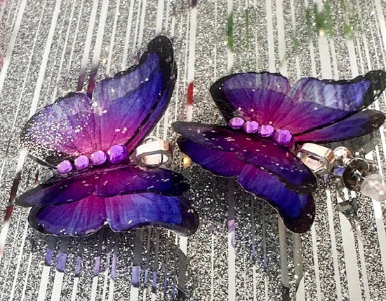 Drag queen butterfly earrings stand out from the crowd