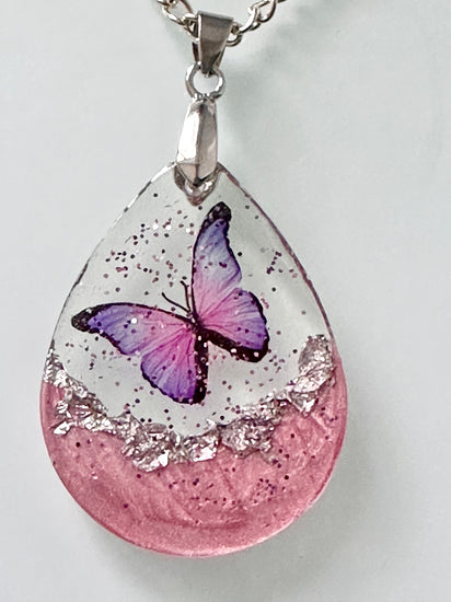 pink and purple butterfly resin pendant