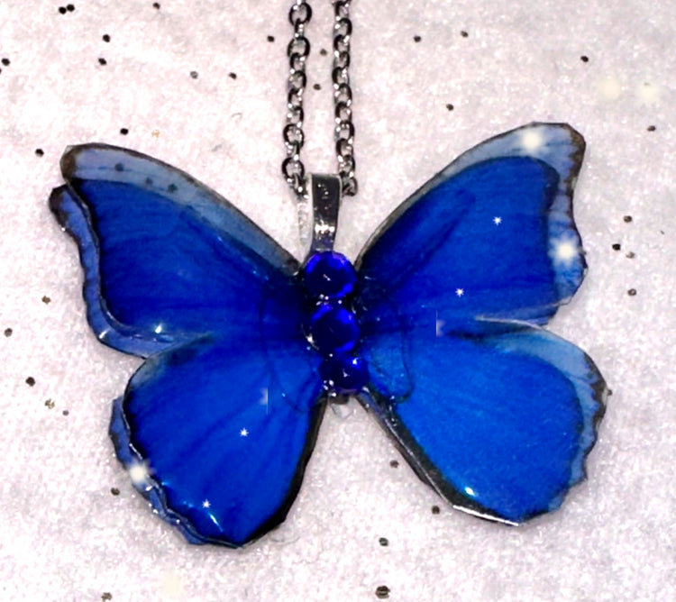 Unique and quirky Blue Morph butterfly pendant