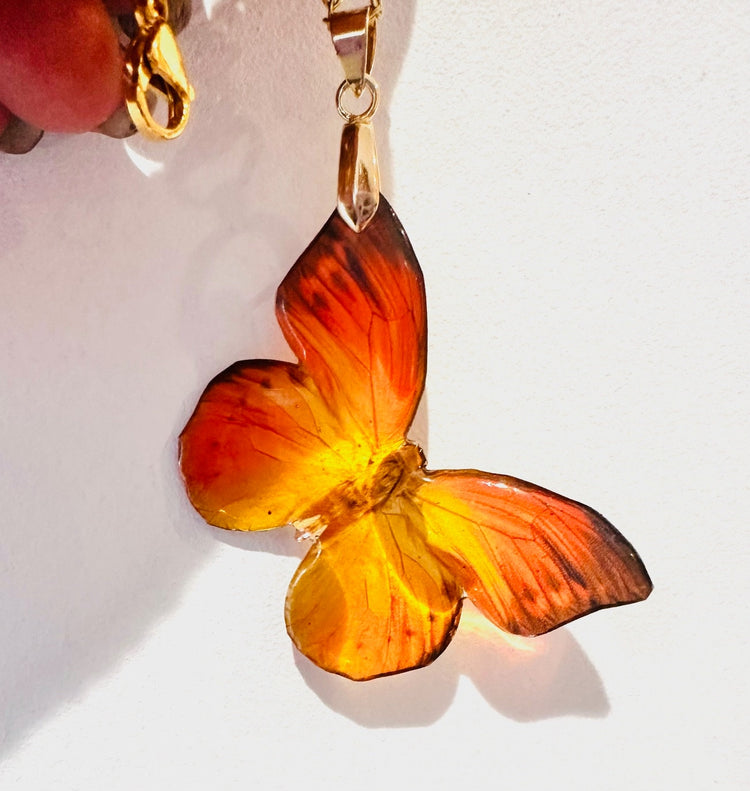 orange and yellow resin butterfly pendant drag queen