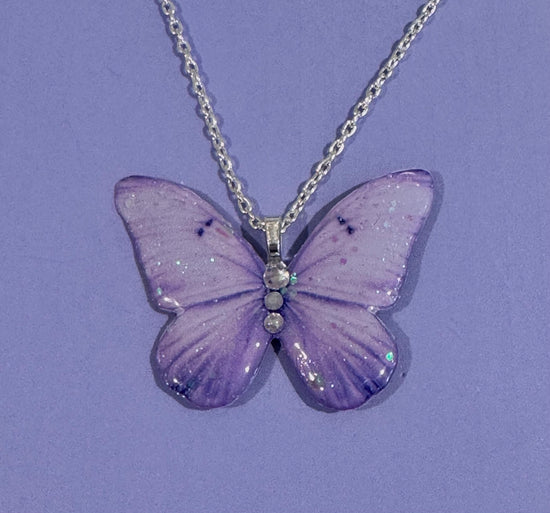 Beautiful lilac butterfly earrings and pendant set.