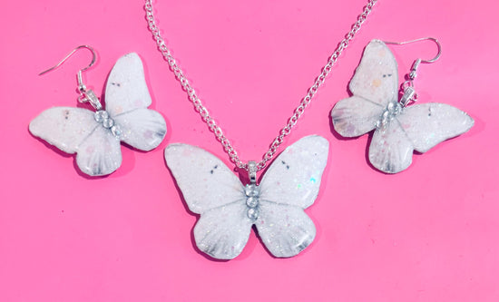 Beautiful white butterfly earrings and pendant set. Sparkly white butterfly jewellery Very unique and chic.