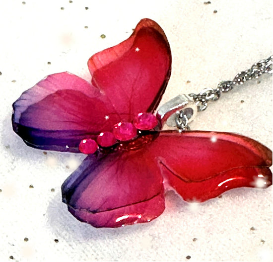 Pink double butterfly pendant. Pink and lilac iridescent resin butterfly pendant