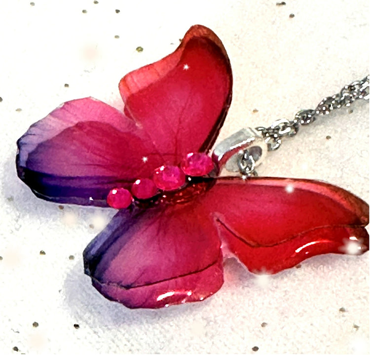 Pink double butterfly pendant. Pink and lilac iridescent resin butterfly pendant