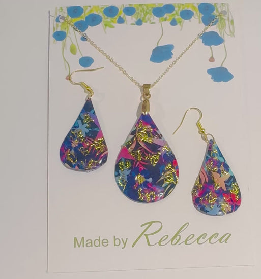 Beautiful bright floral and gold earrings and pendant set. Upcycled tin cans